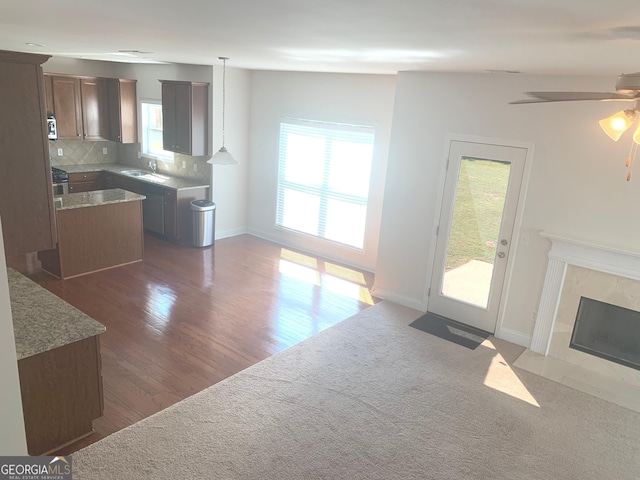2118 Water Mill Ct, Buford, GA 30519 - living room with a premium fireplace, ceiling fan, dark wood-style floors, and baseboards