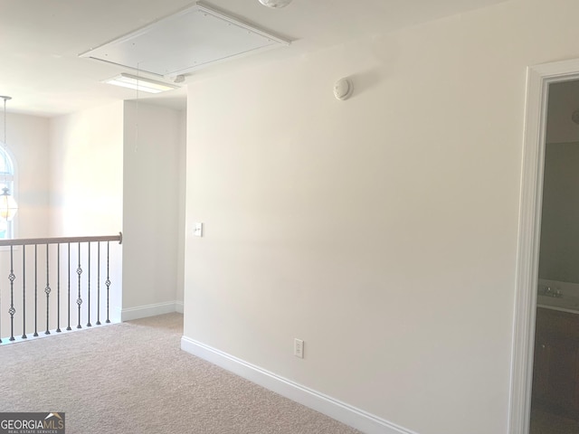 2118 Water Mill Ct, Buford, GA 30519 - spare room with attic access, carpet floors, baseboards, and a smoke detector
