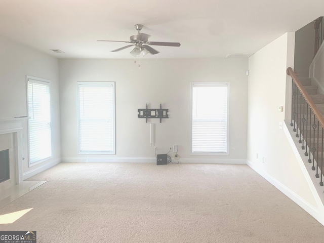 2118 Water Mill Ct, Buford, GA 30519 - unfurnished living room with stairs, carpet, a ceiling fan, and baseboards