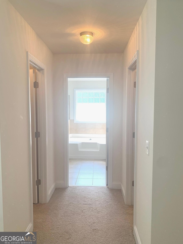 2118 Water Mill Ct, Buford, GA 30519 - corridor with carpet floors, baseboards, and tile patterned floors