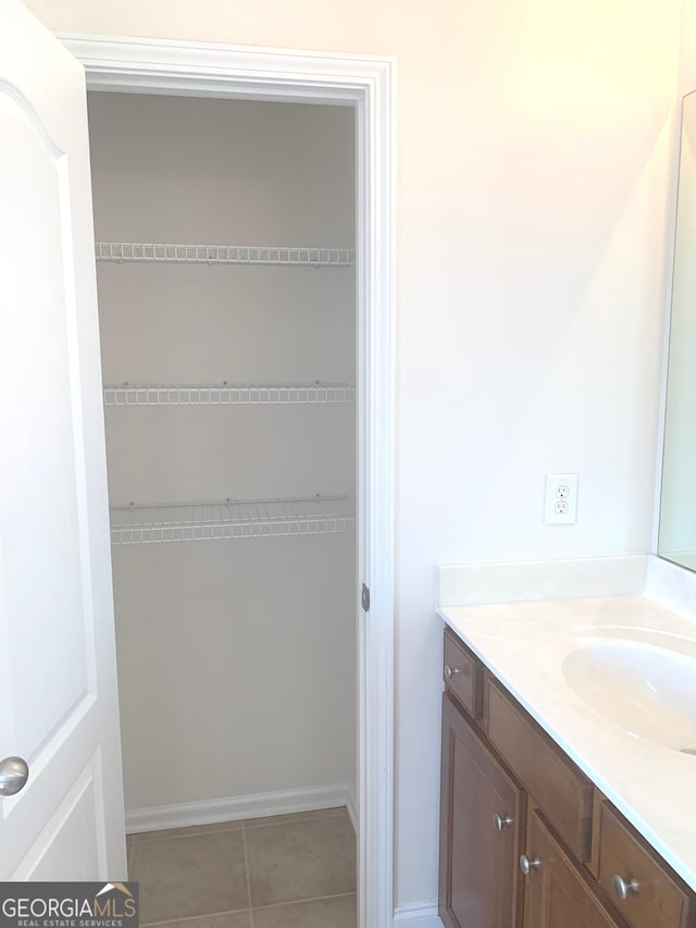 2118 Water Mill Ct, Buford, GA 30519 - bathroom with vanity, tile patterned floors, and baseboards