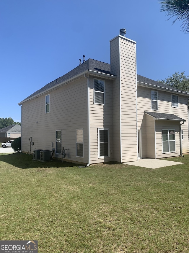 2118 Water Mill Ct, Buford, GA 30519 - back of property with a patio area, a yard, a chimney, and cooling unit
