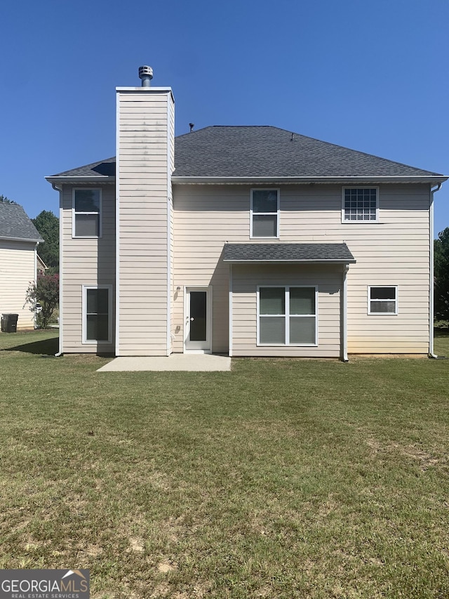2118 Water Mill Ct, Buford, GA 30519 - back of house featuring a yard, a patio area, and a chimney