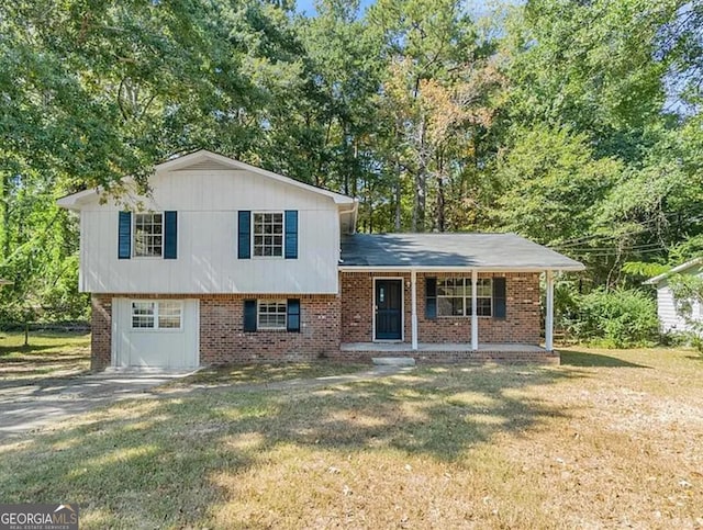 6505 Cedar Hurst Trl, South Fulton, GA 30349 - tri-level home featuring covered porch, a front yard, and brick siding