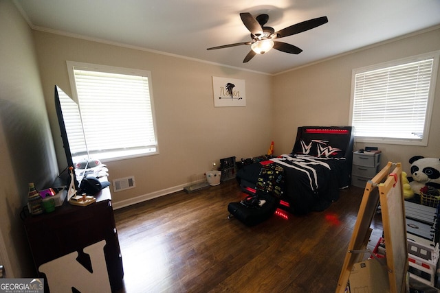 103 Wilson Way, Thomaston, GA 30286 - bedroom featuring multiple windows, wood finished floors, crown molding, and a ceiling fan