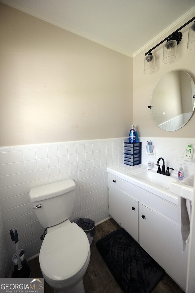 103 Wilson Way, Thomaston, GA 30286 - bathroom with tile walls, wood finished floors, vanity, crown molding, and wainscoting