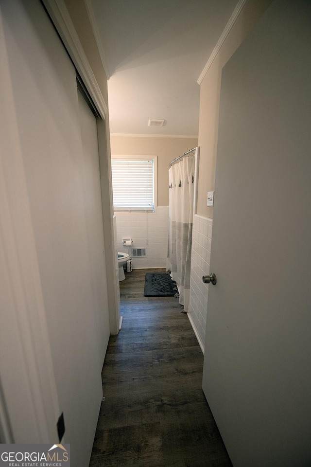 103 Wilson Way, Thomaston, GA 30286 - corridor with tile walls, ornamental molding, a wainscoted wall, and dark wood-style floors
