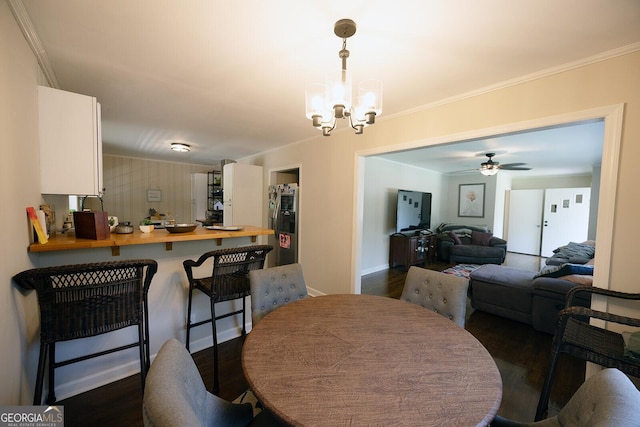 103 Wilson Way, Thomaston, GA 30286 - dining room with a chandelier, dark wood-type flooring, crown molding, and ceiling fan