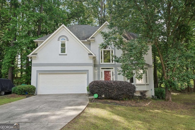 220 Chinkapin Cir SW, South Fulton, GA 30311 - traditional home featuring stucco siding, driveway, a garage, and a front yard