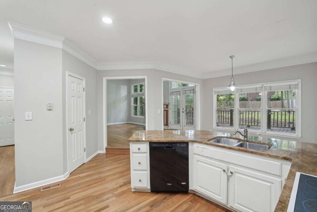 220 Chinkapin Cir SW, South Fulton, GA 30311 - kitchen featuring black dishwasher, crown molding, white cabinets, light wood-type flooring, and light stone counters