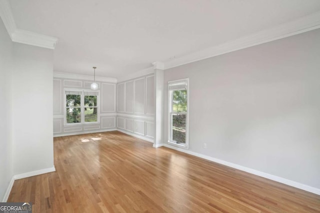 220 Chinkapin Cir SW, South Fulton, GA 30311 - unfurnished room with ornamental molding, light wood-style flooring, and a decorative wall