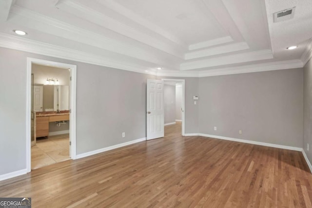 220 Chinkapin Cir SW, South Fulton, GA 30311 - empty room with a raised ceiling, wood finished floors, ornamental molding, and recessed lighting