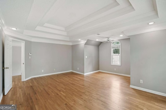 220 Chinkapin Cir SW, South Fulton, GA 30311 - unfurnished room featuring a raised ceiling, ornamental molding, a ceiling fan, recessed lighting, and light wood-type flooring