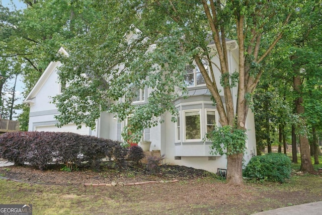 220 Chinkapin Cir SW, South Fulton, GA 30311 - view of side of property featuring stucco siding, crawl space, and a garage