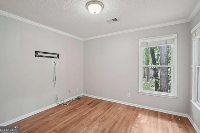 220 Chinkapin Cir SW, South Fulton, GA 30311 - empty room featuring light wood-type flooring, a textured ceiling, and crown molding