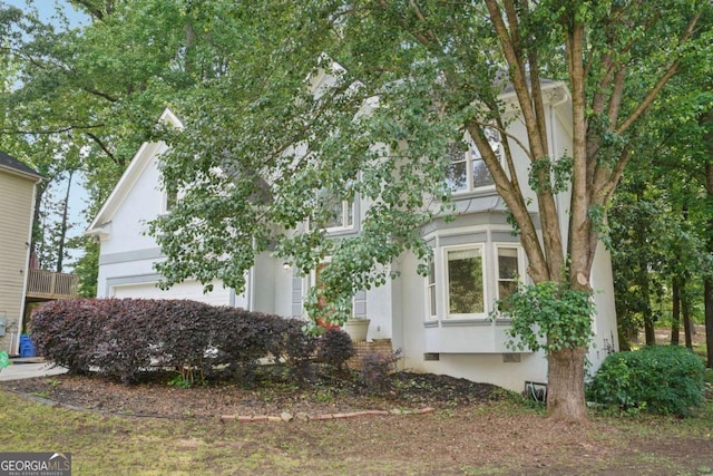 220 Chinkapin Cir SW, South Fulton, GA 30311 - view of home's exterior featuring stucco siding and a garage