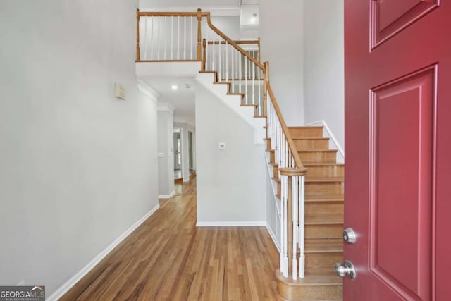 220 Chinkapin Cir SW, South Fulton, GA 30311 - foyer with wood finished floors, stairs, crown molding, and a high ceiling