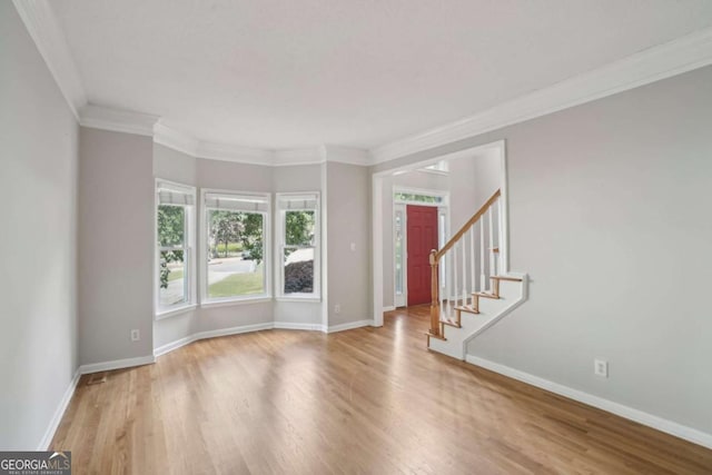 220 Chinkapin Cir SW, South Fulton, GA 30311 - foyer featuring wood finished floors, stairway, and crown molding