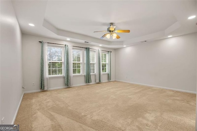 5156 Amberden Hall Dr, Suwanee, GA 30024 - spare room with recessed lighting, a tray ceiling, light colored carpet, and ceiling fan