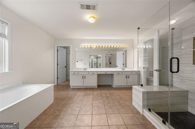 5156 Amberden Hall Dr, Suwanee, GA 30024 - full bathroom with double vanity, a shower stall, a garden tub, and tile patterned floors