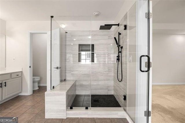 5156 Amberden Hall Dr, Suwanee, GA 30024 - bathroom featuring vanity, a stall shower, and tile patterned floors