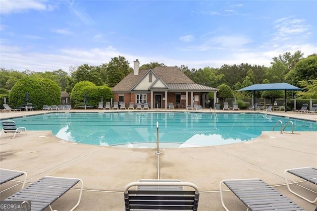 5156 Amberden Hall Dr, Suwanee, GA 30024 - community pool featuring a patio and view of wooded area