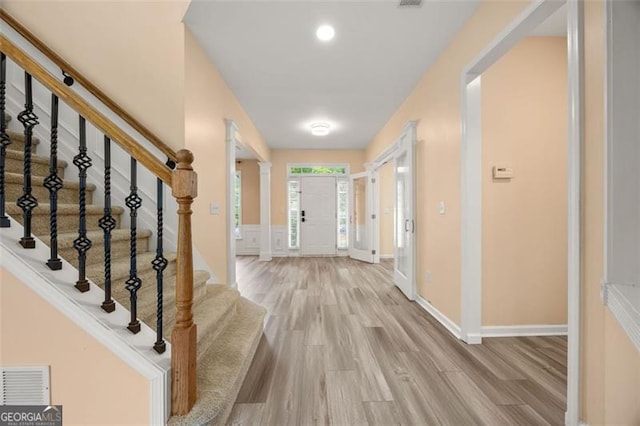 5156 Amberden Hall Dr, Suwanee, GA 30024 - foyer featuring wood finished floors and stairs