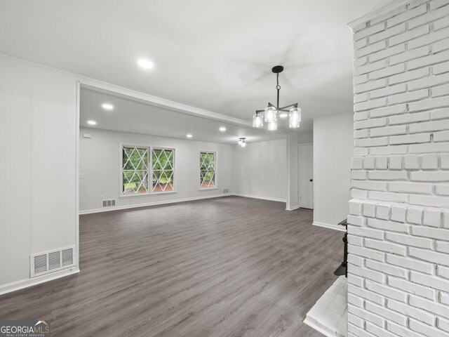 5227 Byers Rd, Gainesville, GA 30504 - unfurnished living room with dark wood-style floors, recessed lighting, a chandelier, baseboards, and crown molding