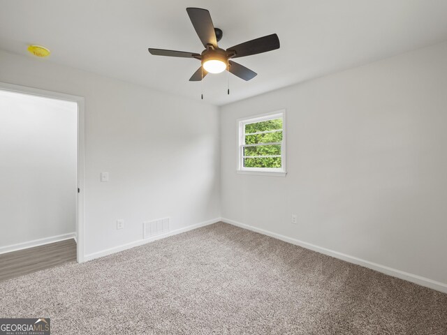 5227 Byers Rd, Gainesville, GA 30504 - carpeted empty room featuring ceiling fan, baseboards, and a smoke detector