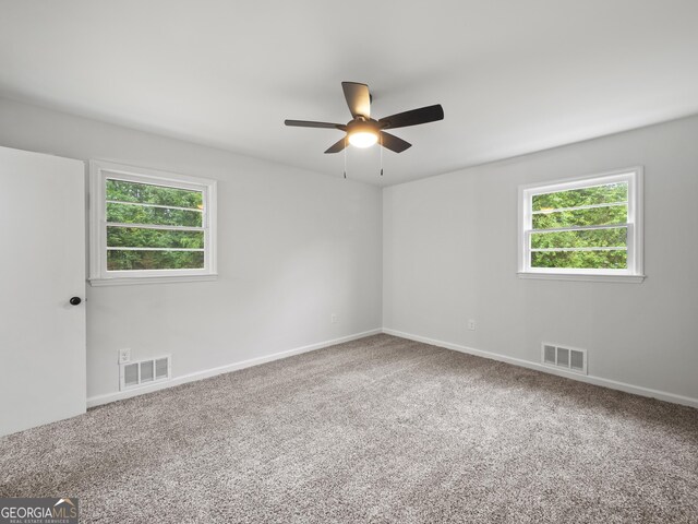 5227 Byers Rd, Gainesville, GA 30504 - spare room featuring healthy amount of natural light, ceiling fan, carpet floors, and baseboards