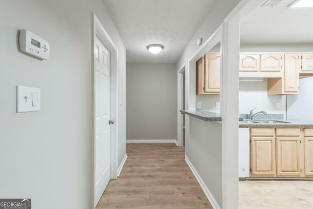 1005 Peachtree Forest Ter, Peachtree Corners, GA 30092 - corridor with a sink, light wood-style floors, baseboards, and a textured ceiling