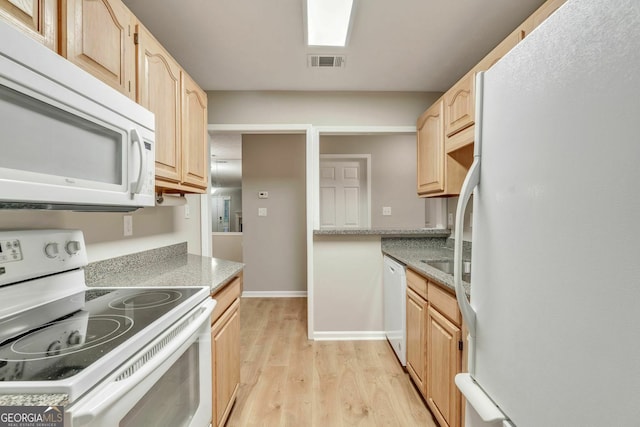 1005 Peachtree Forest Ter, Peachtree Corners, GA 30092 - kitchen featuring white appliances, light brown cabinets, light wood-style flooring, and light countertops