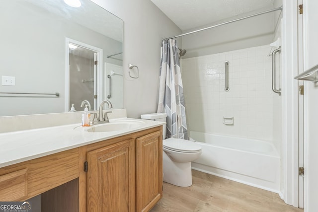 1005 Peachtree Forest Ter, Peachtree Corners, GA 30092 - bathroom featuring shower / tub combo, vanity, wood finished floors, and toilet