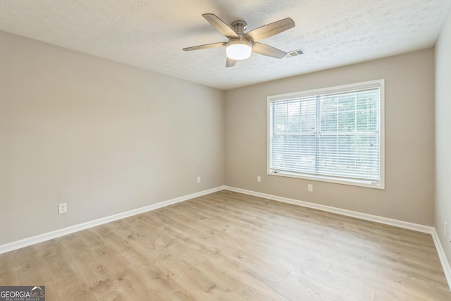1005 Peachtree Forest Ter, Peachtree Corners, GA 30092 - unfurnished room featuring ceiling fan, baseboards, a textured ceiling, and light wood finished floors