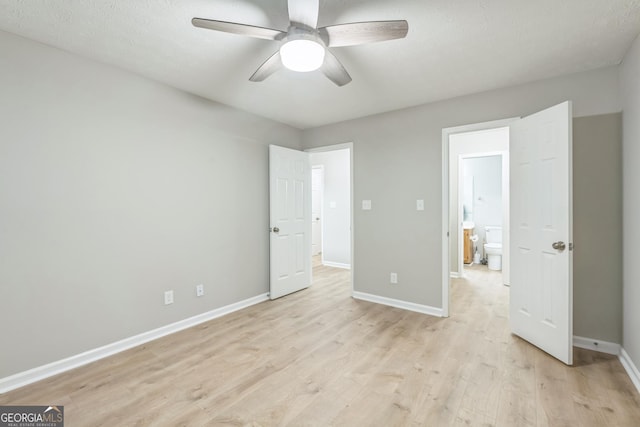 1005 Peachtree Forest Ter, Peachtree Corners, GA 30092 - unfurnished bedroom with baseboards, light wood-type flooring, and a ceiling fan