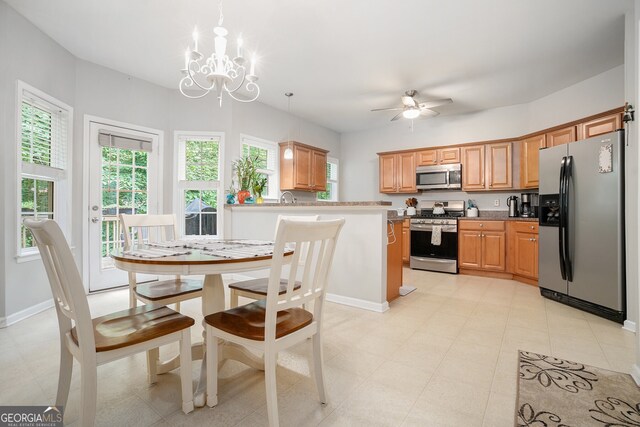 263 Chandler Ridge Dr, Douglasville, GA 30134 - kitchen featuring stainless steel appliances, a chandelier, a ceiling fan, decorative light fixtures, and a peninsula