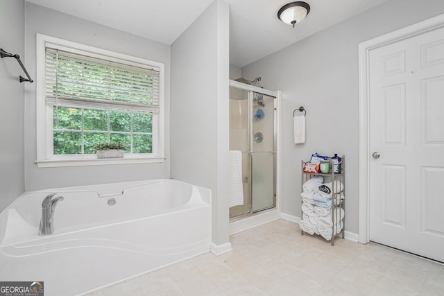 263 Chandler Ridge Dr, Douglasville, GA 30134 - bathroom with a shower stall and a garden tub