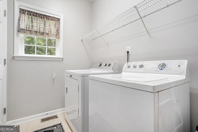 263 Chandler Ridge Dr, Douglasville, GA 30134 - laundry room with washer and dryer and tile patterned floors