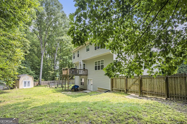 263 Chandler Ridge Dr, Douglasville, GA 30134 - fenced backyard with a deck and a storage shed