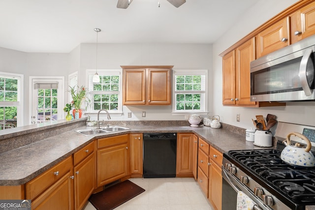 263 Chandler Ridge Dr, Douglasville, GA 30134 - kitchen with appliances with stainless steel finishes, dark countertops, a peninsula, ceiling fan, and hanging light fixtures