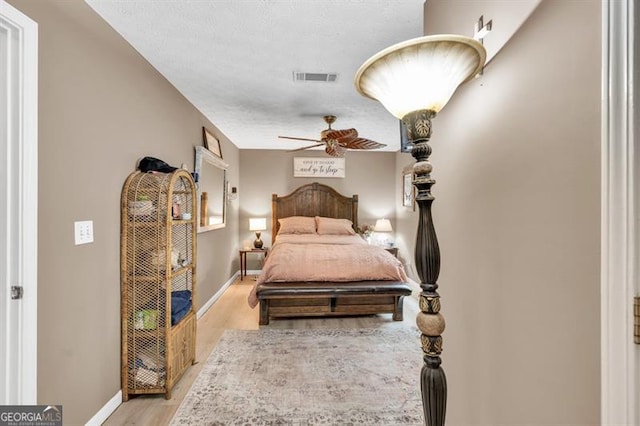 6504 Samoa, Flowery Branch, GA 30542 - bedroom featuring light wood-style floors, baseboards, and a ceiling fan