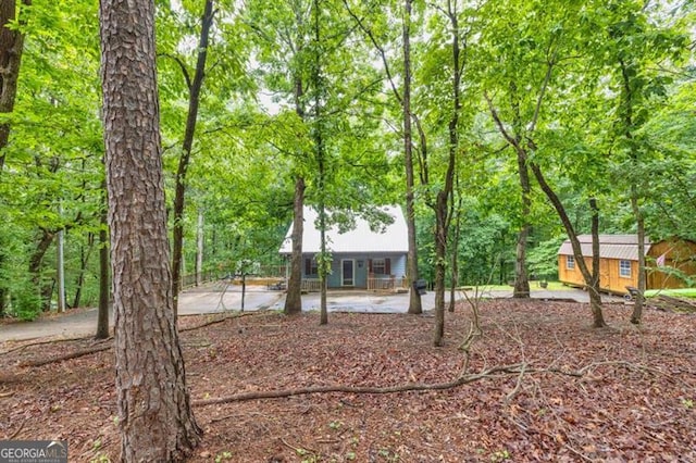 6504 Samoa, Flowery Branch, GA 30542 - view of front of house featuring an outdoor structure and a patio area