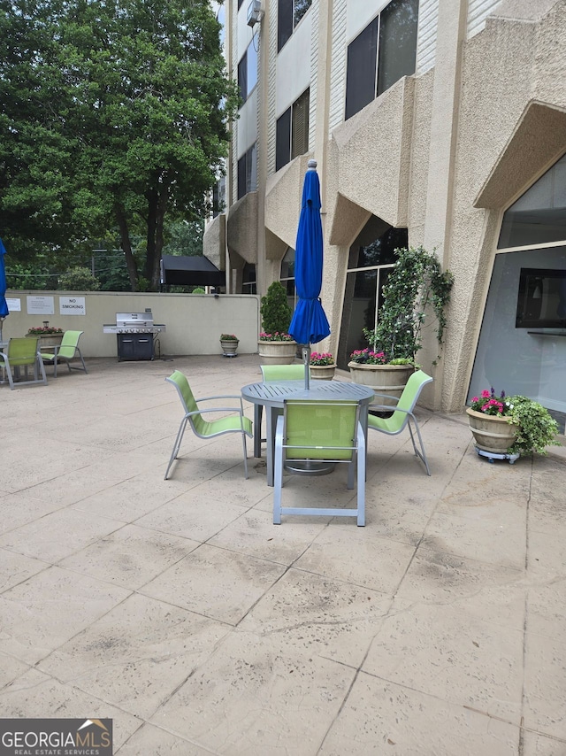2479 Peachtree Rd NE Unit 902, Atlanta, GA 30305 - view of patio / terrace with outdoor dining space and grilling area