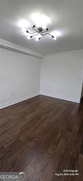 2479 Peachtree Rd NE Unit 902, Atlanta, GA 30305 - spare room with dark wood-style floors and a chandelier