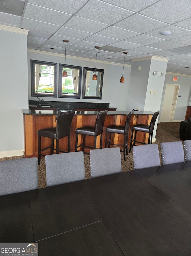 2479 Peachtree Rd NE Unit 902, Atlanta, GA 30305 - indoor dry bar with ornamental molding, pendant lighting, and carpet flooring