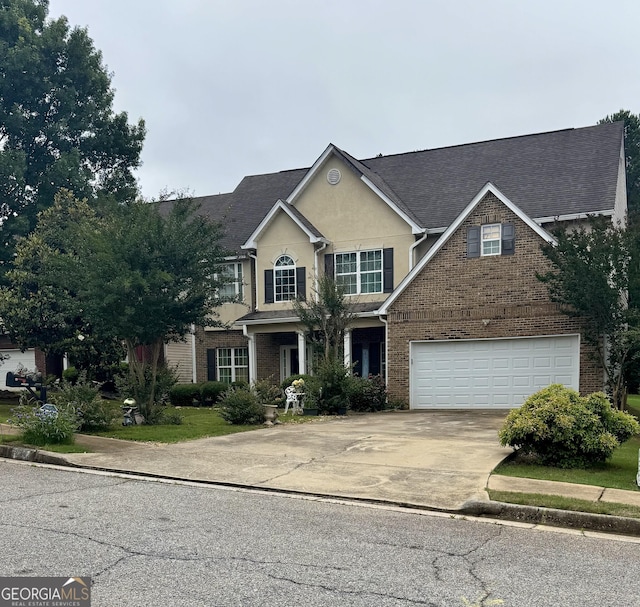12402 Muir Field Ct, Fayetteville, GA 30215 - traditional-style house featuring an attached garage, driveway, brick siding, and stucco siding