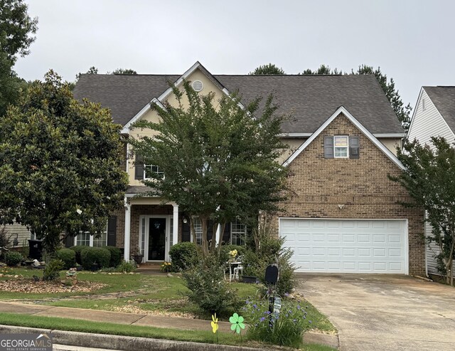 12402 Muir Field Ct, Fayetteville, GA 30215 - obstructed view of property featuring brick siding, driveway, an attached garage, and a shingled roof