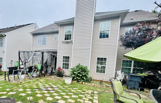 12402 Muir Field Ct, Fayetteville, GA 30215 - back of property with a chimney