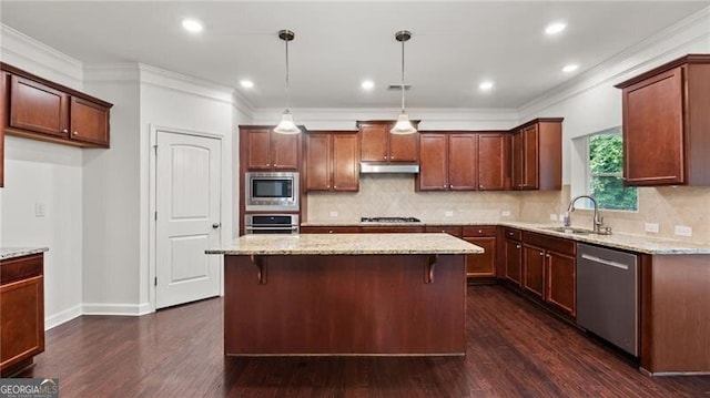 2040 Bloomfield Ct, Cumming, GA 30041 - kitchen featuring appliances with stainless steel finishes, a sink, light stone countertops, dark wood-style floors, and a kitchen island