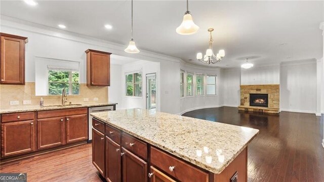 2040 Bloomfield Ct, Cumming, GA 30041 - kitchen with a sink, dishwasher, healthy amount of natural light, crown molding, and dark wood finished floors